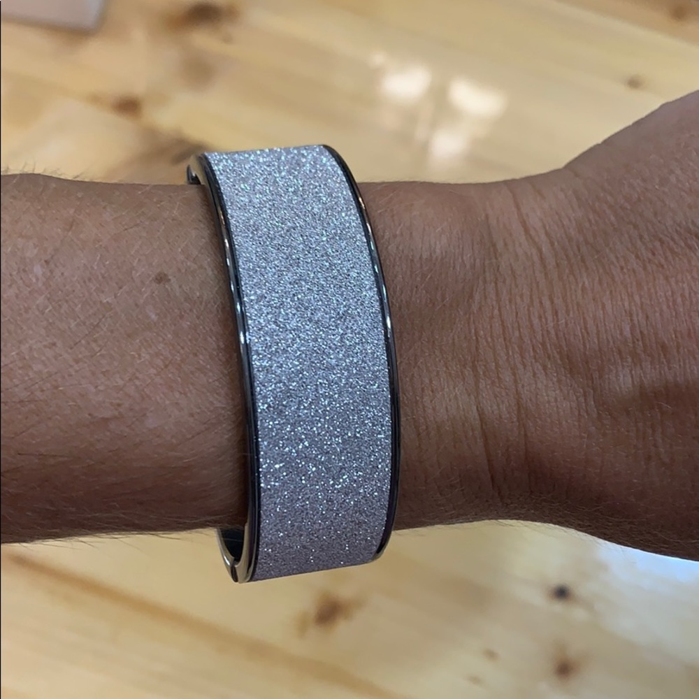 Hinge open sparkly silver bracelet.